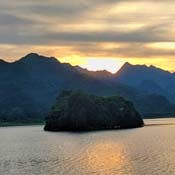 A Vietnamese landscape at sunset over a lake